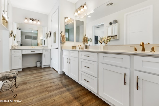 bathroom with vanity and hardwood / wood-style flooring