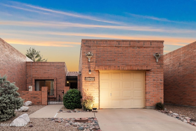 view of front of property with a garage