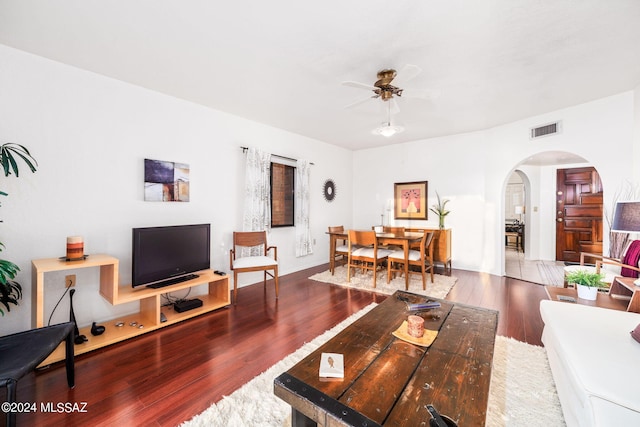 living room featuring ceiling fan and wood-type flooring