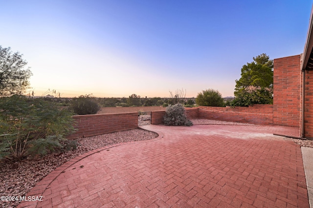 view of patio terrace at dusk