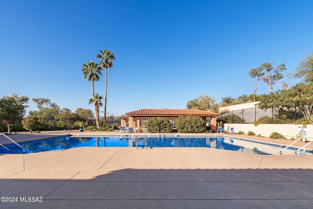 view of swimming pool with a patio