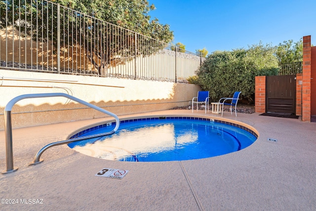 view of swimming pool with a patio