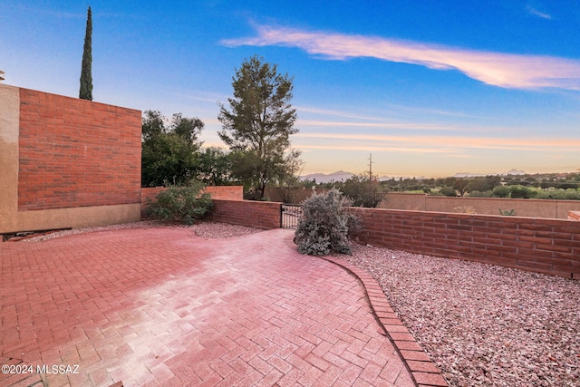 view of patio terrace at dusk