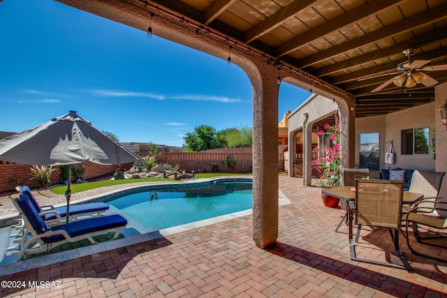 view of swimming pool with a patio