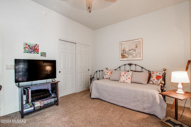 bedroom with carpet flooring, ceiling fan, and a closet