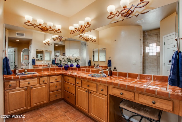 bathroom with tile patterned floors and vanity