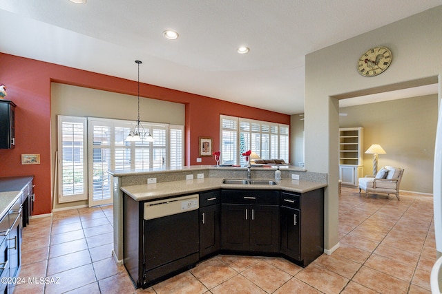 kitchen featuring black dishwasher, sink, kitchen peninsula, and light tile patterned floors