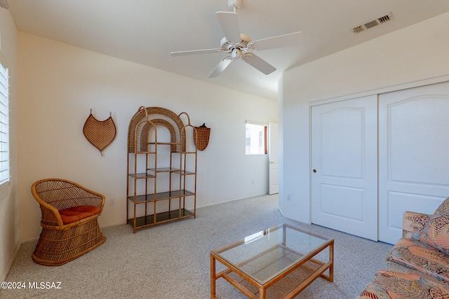 living room featuring ceiling fan and light carpet