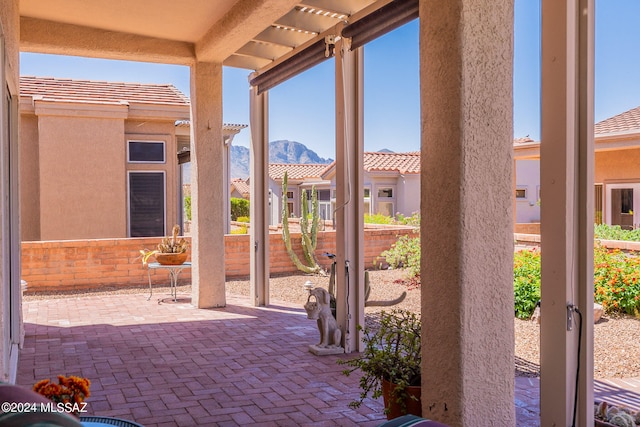 view of patio / terrace featuring a mountain view