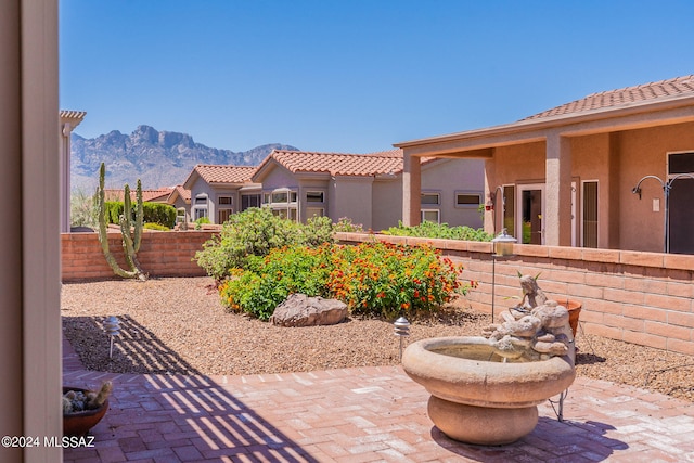 view of patio / terrace with a mountain view