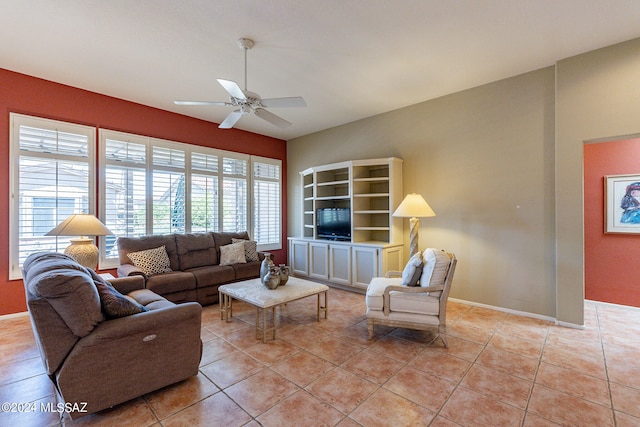 tiled living room with ceiling fan