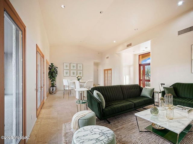 tiled living room featuring lofted ceiling