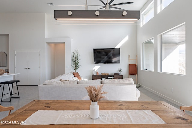 living room with a towering ceiling