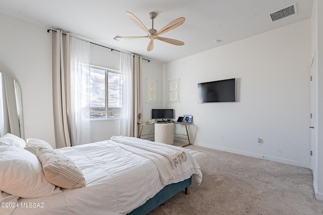 bedroom with ceiling fan, carpet flooring, visible vents, and baseboards