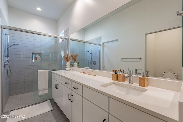 bathroom featuring tile patterned flooring and vanity