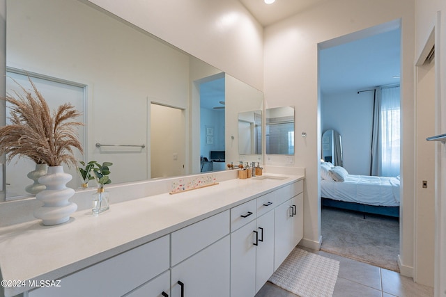 bathroom with tile patterned floors, vanity, and ensuite bathroom