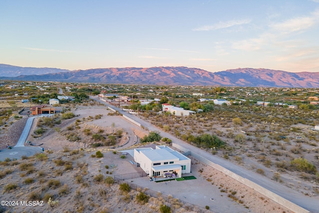 aerial view at dusk with a mountain view