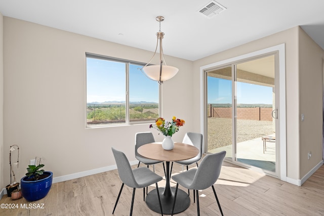 dining area with light hardwood / wood-style flooring