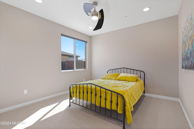 carpeted bedroom with ceiling fan