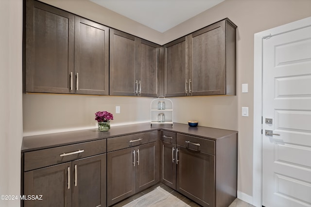 kitchen featuring dark brown cabinets