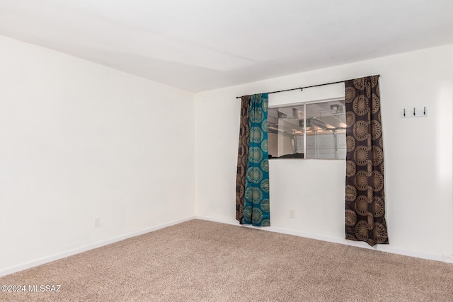 unfurnished room with carpet