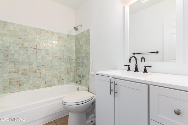 full bathroom featuring vanity, toilet, tiled shower / bath combo, and tile patterned flooring