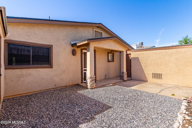 back of house featuring a patio area and central AC unit