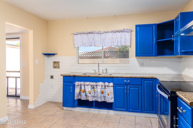 kitchen featuring blue cabinets, sink, stainless steel electric range, and light tile patterned floors