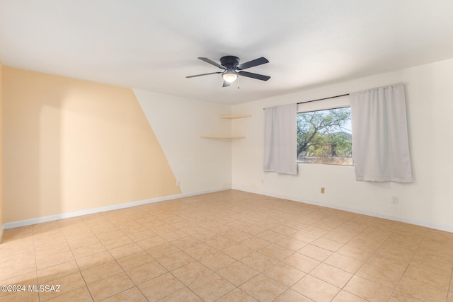 spare room with ceiling fan