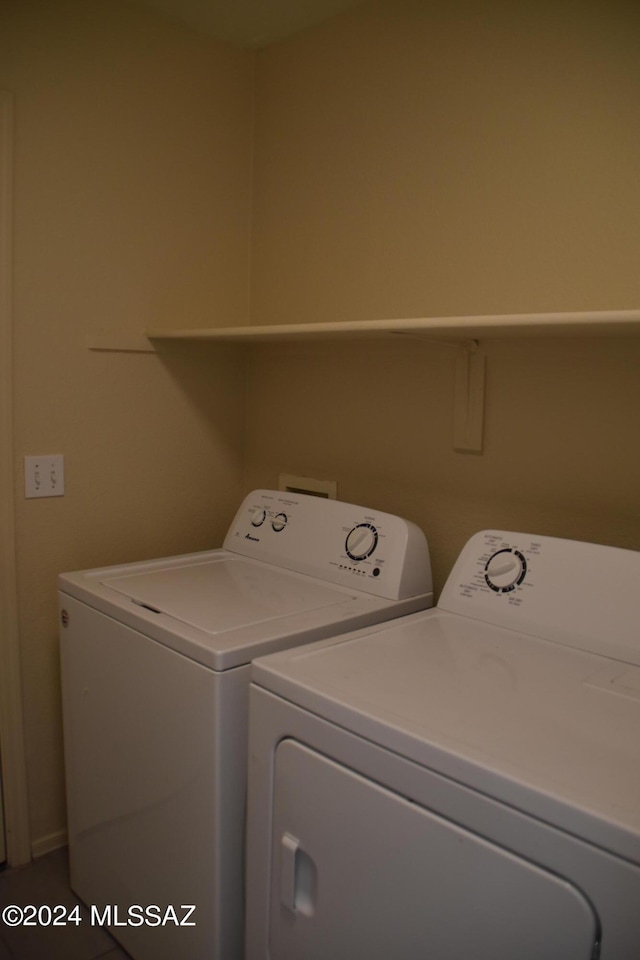 washroom featuring washer and dryer