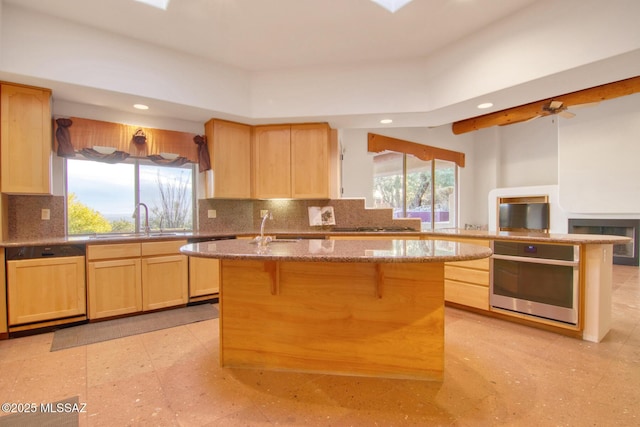 dining area with beamed ceiling, plenty of natural light, and an inviting chandelier