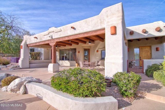 view of patio / terrace featuring ceiling fan, a grill, exterior kitchen, and sink