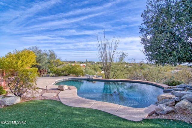 rear view of property featuring a patio and ceiling fan