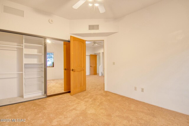 carpeted empty room with ceiling fan