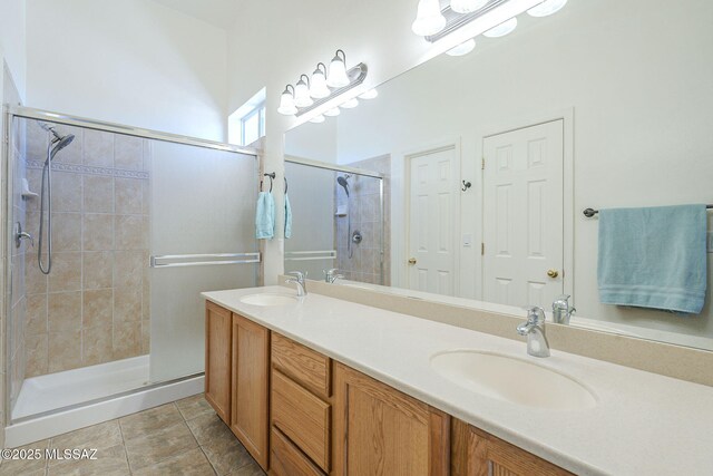 1888 Circulo Guatemala, Rio Rico, AZ 85648 - bathroom featuring a stall shower, double vanity, and tile patterned floors