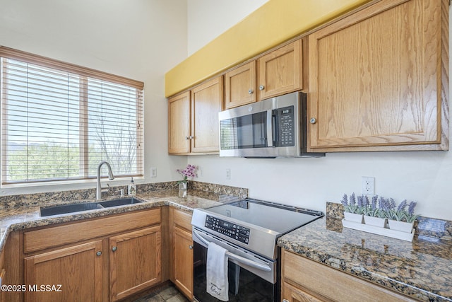 1888 Circulo Guatemala, Rio Rico, AZ 85648 - kitchen with stainless steel appliances, a sink, and dark stone counters
