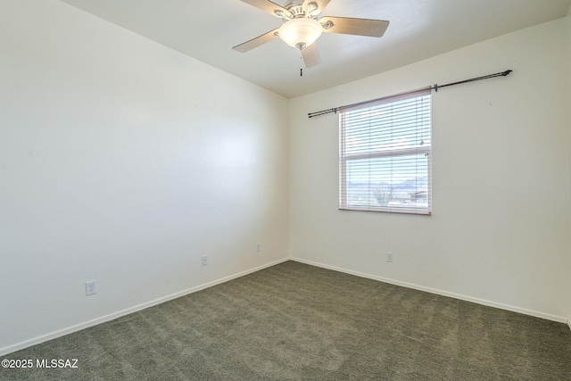 1888 Circulo Guatemala, Rio Rico, AZ 85648 - spare room with dark colored carpet, baseboards, and a ceiling fan