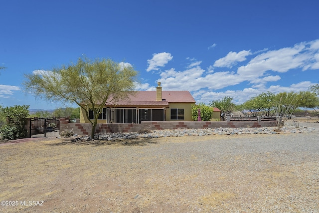 1888 Circulo Guatemala, Rio Rico, AZ 85648 - rear view of property with a tiled roof, a sunroom, a chimney, fence, and stucco siding