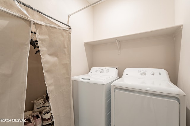 laundry area featuring washing machine and clothes dryer