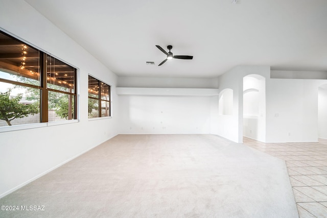 unfurnished room with light carpet and ceiling fan