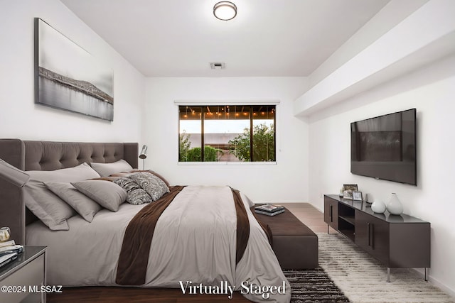 bedroom featuring wood-type flooring