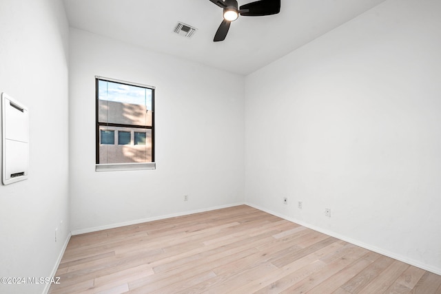 spare room featuring ceiling fan and light hardwood / wood-style flooring