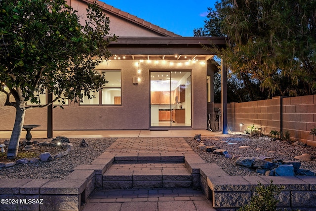 back of property featuring a patio