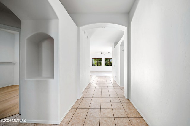 corridor with light tile patterned floors