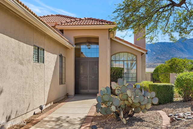 doorway to property featuring a mountain view