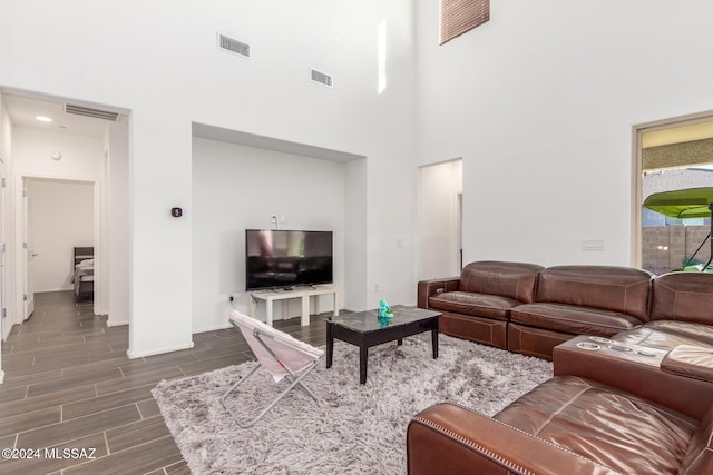 living room with a towering ceiling