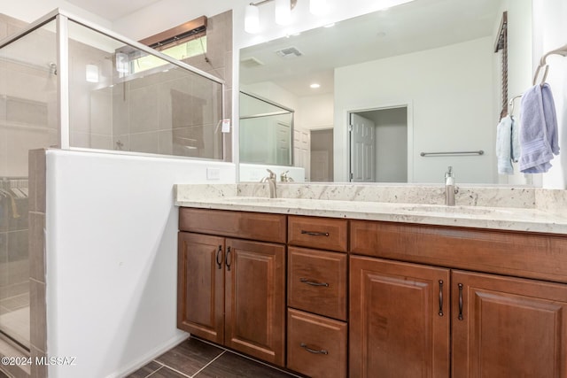 bathroom with vanity and an enclosed shower