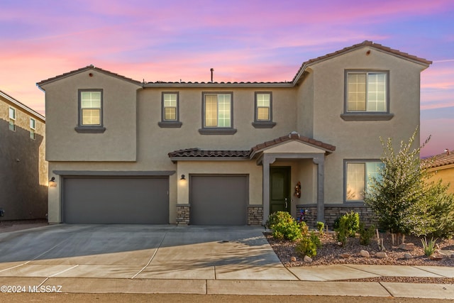 mediterranean / spanish-style house featuring a garage