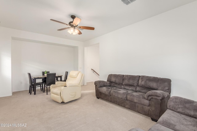 living room with ceiling fan and light carpet