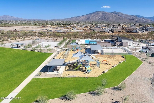 birds eye view of property with a mountain view